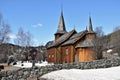 Old Hol Gamle Kyrkje church building stands in the countryside, near a winding road Royalty Free Stock Photo