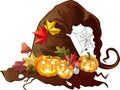 Old holed witch hat with halloween pumpkins, autumn leaves, fly agarics and spiderweb on isolated background