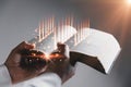 Old holy Bible on black background, Prayer with a Holy Bible in church concept for faith, spirituality and religion, woman praying Royalty Free Stock Photo