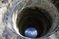 Old holy dug water well thai style in garden at Wat Kiean Bang Kaew temple Royalty Free Stock Photo