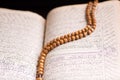 Old holy quran with Rosary Royalty Free Stock Photo