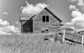 Old home in tall prairie grass with a farm truck in foreground Royalty Free Stock Photo