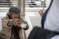 Old homeless man ask for money but refuse Royalty Free Stock Photo