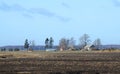 Old homestead in spring field, Lithuania