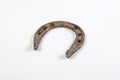 Old horse horseshoe lies on a white background