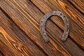 Old rusty horseshoe on vintage wooden board Royalty Free Stock Photo