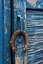 Old horseshoe hanging on the door handle
