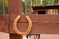 an old horseshoe nailed to the fence