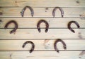 Old horseshoes fixed on a wooden wall Royalty Free Stock Photo