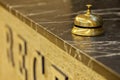 Old hotel bell on a marble stand Royalty Free Stock Photo