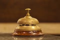 Old hotel bell on a wood stand Royalty Free Stock Photo