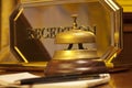 Old hotel bell on a wood stand Royalty Free Stock Photo