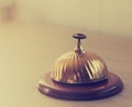 Old hotel bell on a wood stand Royalty Free Stock Photo