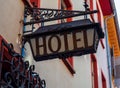 Old hotel sign made of metall on a medieval fascade Royalty Free Stock Photo