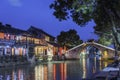 Old house along the river and Huanxiu bridge at night