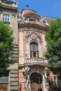 Old house with angels on roof and atlas on both sides