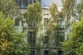 Old house behind a modern glass facade Royalty Free Stock Photo