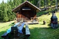 Old house, bench and table in Cadore in Dolomity mountains, Italy