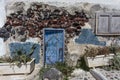 Old house with a blue door in Oia, Santorini - The Cyclades, Greece Royalty Free Stock Photo