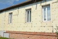 Old house brick wall renovation with facade styrofoam insulation Royalty Free Stock Photo