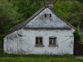 Old house with broken windows and cracked wall Royalty Free Stock Photo