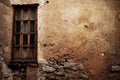 Old house building with window over beautiful autumn nature background. Historic architectural ruins surrounded last