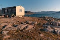 An old house built on permafrost by the sea in the arctic. In the remote Inuit community of Qikiqtarjuaq, Broughton