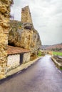 Old house built on the rock with castle ruins, Calatanazor, Spain.