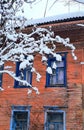 old house with carvings under the snow