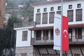 Old house with closed shutters and Turkish flags, Alanya, November 2021 Royalty Free Stock Photo