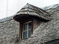 Old house with dormer and shingles