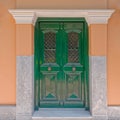 Old house entrance green painted wooden door Royalty Free Stock Photo