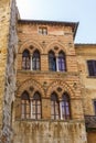 Old house facade with mullioned windows in italy Royalty Free Stock Photo