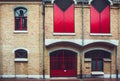 Old House facade with red shutters