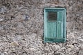 Old house facade with wooden window and closed shutter Royalty Free Stock Photo