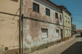 Old house facade with worn paint on plaster wall Royalty Free Stock Photo