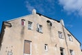 Old house front with satellite dishes Royalty Free Stock Photo