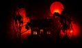 Old house with a Ghost in the moonlit night or Abandoned Haunted Horror House in fog. Old mystic villa with surreal big full moon. Royalty Free Stock Photo