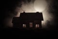 Old house with a Ghost in the moonlit night or Abandoned Haunted Horror House in fog, Old mystic villa with surreal big full moon. Royalty Free Stock Photo