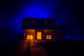 Old house with a Ghost in the moonlit night or Abandoned Haunted Horror House in fog, Old mystic villa with surreal big full moon. Royalty Free Stock Photo