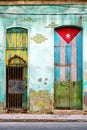 Old house in Havana with a painted cuban flag