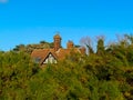 An old house hidden in the trees at Bawdsey in Suffolk