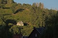 Old house on a hill with trees in the evening sun in La-Roche-En-Ardenne