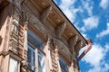 Ancient wood carving on the house in daylight against the blue sky Royalty Free Stock Photo