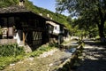 Old house near river in sunny day Royalty Free Stock Photo