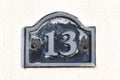 House number 13 on concrete wall. Royalty Free Stock Photo