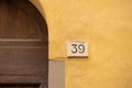 Old House number on a weathered wall. Close-Up Of Number 39 on stone wall Royalty Free Stock Photo