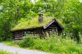 Old house in the open-air museum in Norway, wooden walls and grass roof