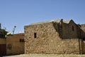 Old house with parabolic antenna close to a ruin