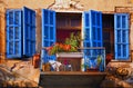 An old house with renewed blue windows shutters Jaffa Israel Royalty Free Stock Photo